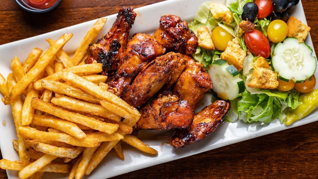 Smokey Fried Wings · Smoked, then fried wings tossed in your choice of sauce. Served with French Fries.