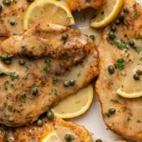 Chicken Piccata · Chicken cutlets breaded with panko bread crumbs, pan-fried, and served with a lemon caper be...