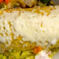 Wet Burrito · Any meat, rice, beans, onions, cilantro, cheese tomato, lettuce, guacamole and crem with gre...