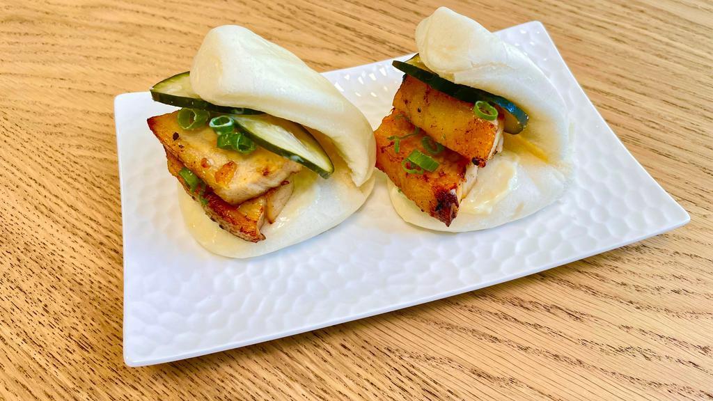 Pork Buns · Steamed bun with oven roasted confit pork belly, pickled cucumber, scallions, japanese mayo and hoisin sauce. (2 per order)