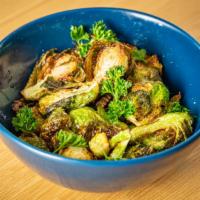 Brussels Sprouts · fried and tossed with ginger scallion sauce. 
(gluten free)