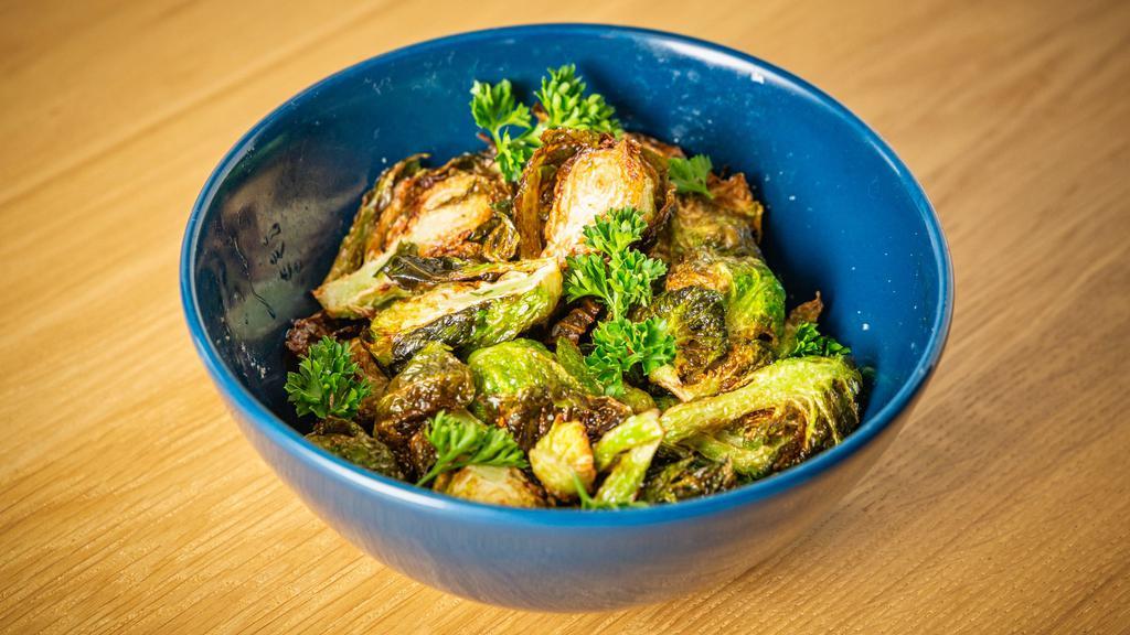 Brussels Sprouts · fried and tossed with ginger scallion sauce. 
(gluten free)