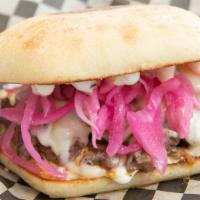 The Steak Beastie · Carne asada, hot cherry peppers, red pickled onions, provolone cheese, and rosemary aioli on...