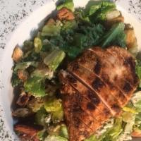Blackened Chicken Caesar Salad · Full-sized Caesar salad tossed with our house dressing, made from scratch croutons, Asiago c...