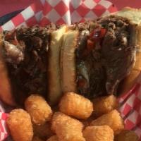 Attic Cheesesteak · Thinly shaved sirloin grilled with sauteed onions, peppers and melted American Cheese