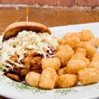 Bbq Pulled Pork Sandwich · Slow roasted BBQ pulled pork topped with creamy slaw on a toasted bun