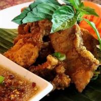 Crispy Pork Belly (8) · Deep fried pork belly marinated with Thai seasoning with roasted rice powder 
lime chili dip...