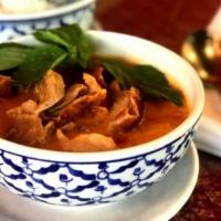Red Curry With Roasted Duck · A delicious Barbeque duck in red curry sauce with pineapple, bell peppers, Thai basil leaves...