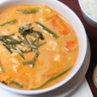 Panang Curry · Panang curry cooked in coconut milk with carrot, snow peas, and green bean.