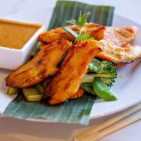 Kai Satay Plate (Chicken Satay Entrée) · Grilled chicken marinated in Thai spices, served with peanut sauce on a bed of steamed mixed...