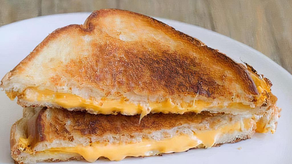 Grilled Cheese · Melted cheddar and american cheese on your choice of bread.