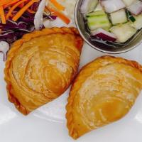 Curry Puff · Crispy pastry stuffed with a variety of savory fillings such as potatoes onions and carrots