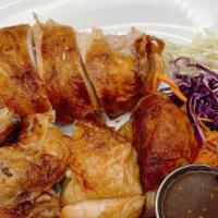 S-8 Thai Bbq Chicken · Half Chicken marinated with Thai herbs serve with plum sauce,Thai spicy sauce and a side of ...