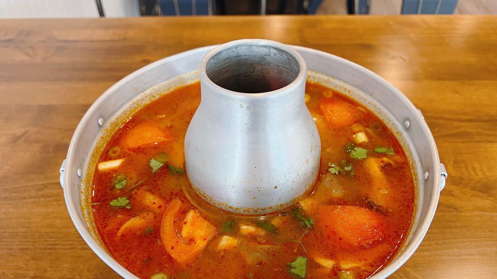 Tom Yum (Gf) · Spicy and sour soup with tomato, mushroom, lemongrass, cilantro,green onions and onions.