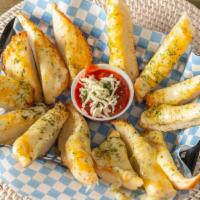 Garlic Cheese Bread · Topped with mozzarella and cheddar. Served with marinara.