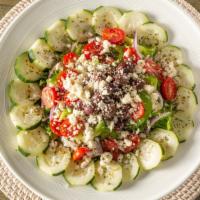 Greek Salad · Romaine, Feta, green peppers, onions, tomatoes, cucumber, kalamata olives, with olive oil.