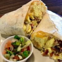 Breakfast Burrito · Scrambled eggs, cheese and your choice of bacon, ham, sausage, carnitas or sautéed veggies, ...
