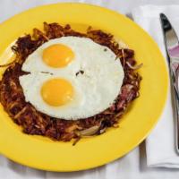 Country Hash & Eggs · Our house-made corned beef, potatoes and onions, topped with 2 eggs. 
Served with biscuits o...