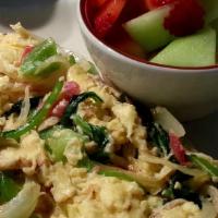 Tucker'S Veggie Scramble · 2 eggs scrambled with tomatoes, onions, mushrooms, peppers, spinach, and topped with cheese ...