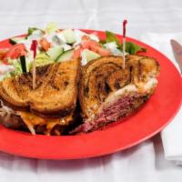 Reuben · House-made corned beef, sauerkraut, swiss cheese and thousand island dressing on grilled rye...