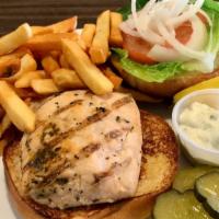 Grilled Salmon Burger · Topped with lettuce, tomato, onion and tartar sauce. Served with French fries.