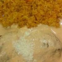 Chile Relleno · 2 chiles rellenos stuffed with mexican cheese, served with rice, beans, lettuce, pico de gal...
