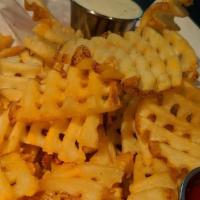Seasoned Waffle Fries · Small, large, or pan sizes available. An instant classic!