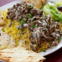 Shawarma Plate · Beef, lamb, or chicken marinated in our Egyptian spices. Topped with hummus, rice, veggie sa...