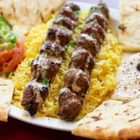 Kofta Kabab Plate · Ground beef mixed with onions, parsley, cilantro, and special spices. Served with hummus, ri...