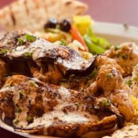 Vegetable Plate · Hummus, baba ghanouj, rloe, salad, pita bread and tahini sauce.