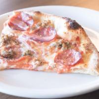 Di Carne Pizza · Tomato sauce, pork sausage, fresh mozzarella, prosciutto cotto, salami and grana padano.