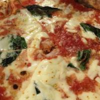 Margherita Pizza · Tomato sauce, fresh mozzarella, basil, extra virgin olive oil and grana padano.