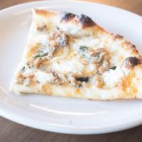 Bianca Pizza · Roasted garlic, oil, goat cheese, mozzarella, basil, roasted onions, pork sausage, and grana...