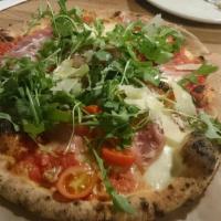 Di Parma Pizza · Tomato sauce, cherry tomatoes, fresh mozzarella, prosciutto di parma, arugula, red onions ex...