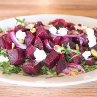 Bietole Salad · Arugula, beets, goat cheese, pistachios and red onions.