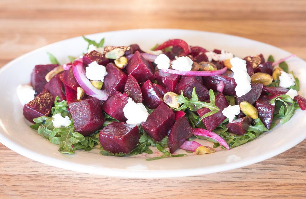 Bietole Salad · Arugula, beets, goat cheese, pistachios and red onions.