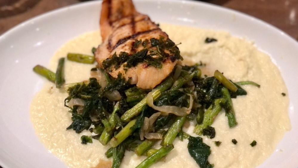 Grilled Salmon · Grilled Salmon with cauliflower puree, sautéed asparagus, spinach, and caramelized onions.