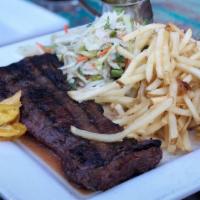 Churrasco Con Chimichurri · Grilled skirt steak topped with a garlic-parsley chimichurri, mojo fries with house-made ket...