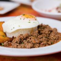 Picadillo Al Caballo · Ground beef, sofrito, raisins, potatoes and olives stewed in a light tomato creole sauce, wh...