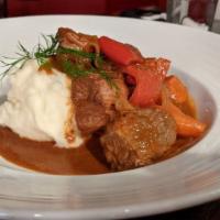 Goulash · Paprika beef stew, carrots, peppers, onions, mashed potatoes