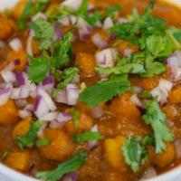 Channa Masala · Chickpeas cooked with onion & tomatoes seasoned with blended spices