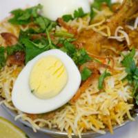 Chicken Dum Biryani · Bonein chicken cooked with basmati rice, flavored with saffron and aromatic spices - world r...