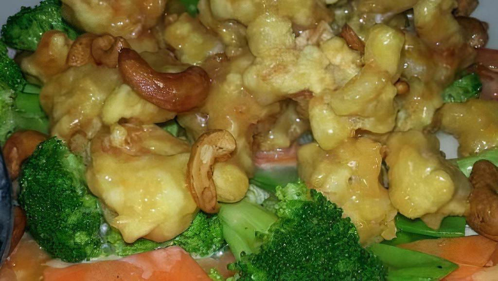 Cashew Shrimp · Lightly breaded shrimp with house cream sauce and a hint of citrus, served with steamed vegetables.