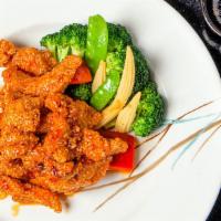 John Holly'S  Chicken Coating With Sesame · strip of white meat chicken coating with sesame, flash fried and tossed in a medium spicy to...