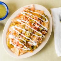 Nachos · With meat for an additional charge.