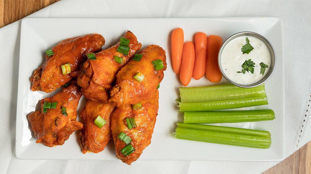 The Wings · Jumbo wings cooked to perfection and tossed in your choice of buffalo, BBQ, Korean BBQ, garlic parmesan, sweet chili sauce, lemon pepper, or Cajun. Served with ranch or blue cheese, carrots, and celery.