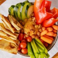 Hummus · Vegetarian. Scratch-made hummus with hints of garlic, topped with spiced chickpeas and serve...