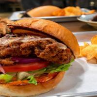 Fried Chicken Sandwich · Beer-battered chicken breast sandwich with sweet slaw, buffalo sauce, dill chips, and topped...