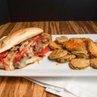 Philly Cheesesteak · Thinly sliced, juicy sirloin steak sautéed with onions and red peppers, smothered with peppe...