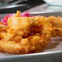 Fish 'N' Chips · Beer battered cod accompanied with sweet slaw, scratch-made tartar sauce, and sidewinder fri...